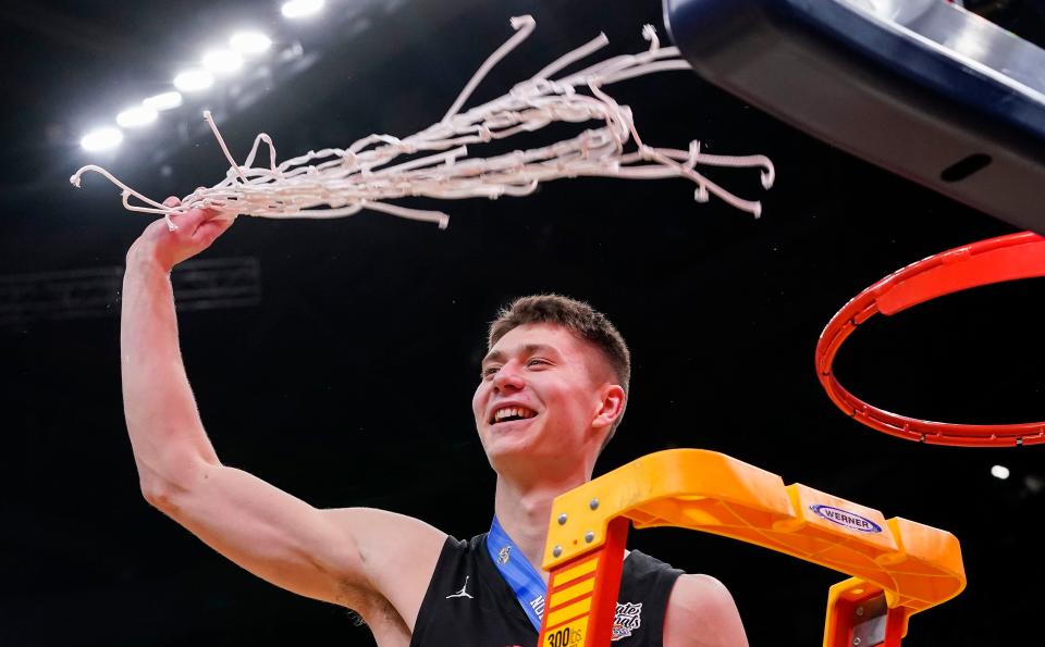 NorthWood Panthers forward Ian Raasch (2) swings the net on Saturday, March 25, 2023 at Gainbridge Fieldhouse in Indianapolis. The NorthWood Panthers lead at the half against the Guerin Catholic Golden Eagles, 66-63 in overtime for the IHSAA Class 3A state finals championship. 
