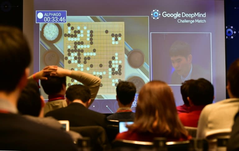 Journalists watch live footage of the third game of the Google DeepMind Challenge Match between Lee Se-Dol and the AlphaGo supercomputer in Seoul, on March 12, 2016
