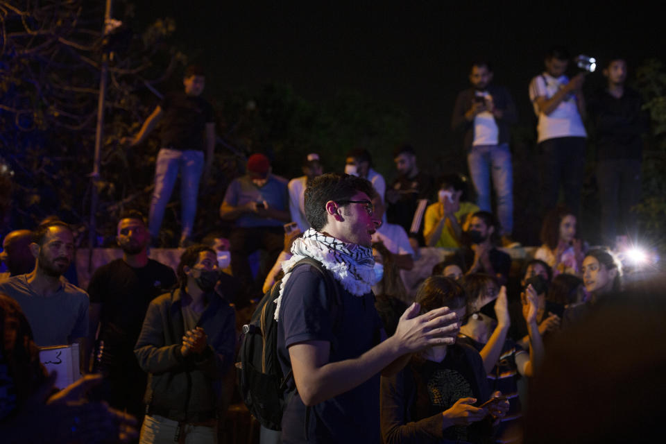 Palestinians chant slogans at a protest on the eve of a court verdict that may forcibly evict Palestinian families from their homes in the Sheikh Jarrah neighborhood of Jerusalem, Wednesday, May 5, 2021. Several Palestinian families in Sheikh Jarrah have been embroiled in a long-running legal battle with Israeli settler groups trying to acquire property in the neighborhood near Jerusalem's famed Old City. (AP Photo/Maya Alleruzzo)