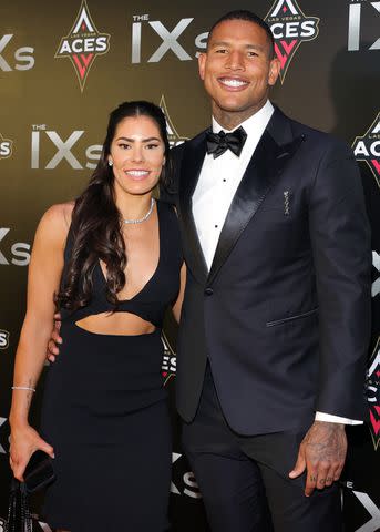 <p>Ethan Miller/Getty </p> Kelsey Plum and Darren Waller