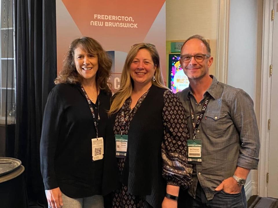 Emma Chevarie, (centre) music-lover and ECMA organizer, is seen here with delegates Liz Scott and Neil Pearson getting set to enjoy one of the the many artist showcases. (Submitted by Emma Chevarie - image credit)