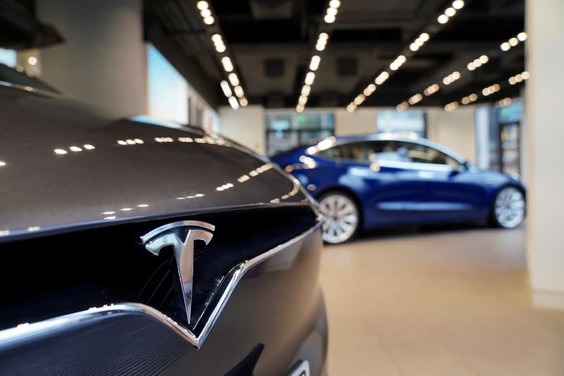 FILE PHOTO: A Tesla logo is seen at a Tesla showroom in Shanghai