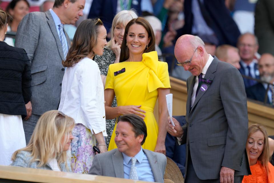 Britain's Kate, Duchess of Cambridge chats to Former Wimbledon champion Martina Hingis as she arrives in the Royal Box (AP)