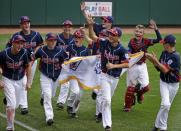 The Endwell, N.Y., team takes a victory lap of the field at Lamade Stadium after a win in the Little League World Series Championship baseball game over South Korea in South Williamsport, Pa., Sunday, Aug. 28, 2016. (AP Photo/Gene J. Puskar)