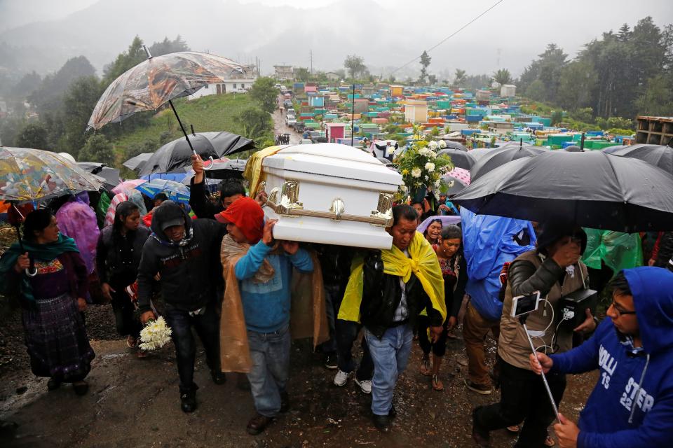 Men carry the casket of Claudia Gomez, a Guatemalan immigrant who was shot by a U.S. Border Patrol officer, during her funeral in Guatemala on June 2, 2018.