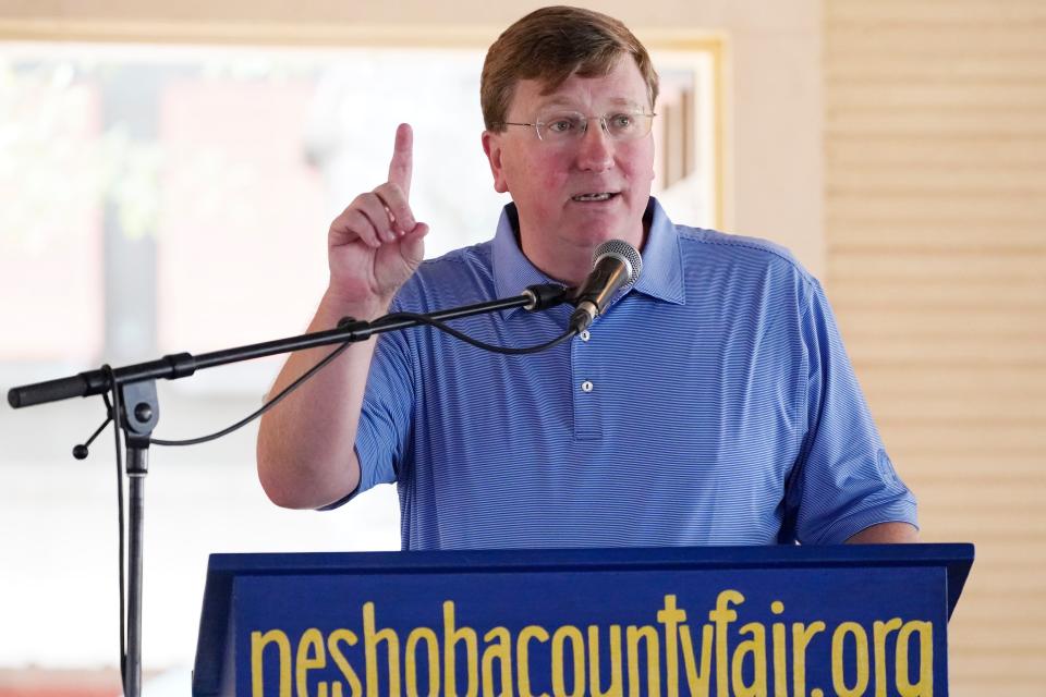 Republican Gov. Tate Reeves tells fairgoers of that he will seek additional funds for public school teachers salaries at the Neshoba County Fair in Philadelphia, Miss., Thursday, July 29, 2021. The fair, also known as Mississippi's Giant House Party, is an annual event of agricultural, political, and social entertainment at what might be the country's largest campground fair.