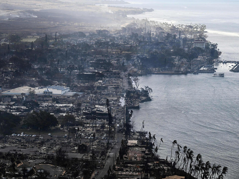 An aerial view shows destroyed homes and buildings in historic Lahaina, in the aftermath of wildfires in western Maui, Hawaii, August 10, 2023.  / Credit: PATRICK T. FALLON/AFP via Getty Images