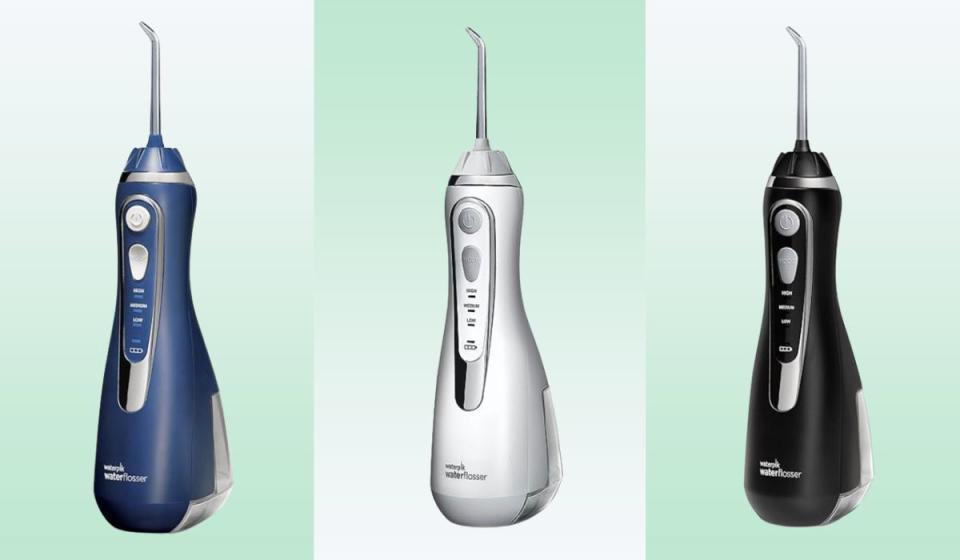 Three Waterpik flossers on a white and green background