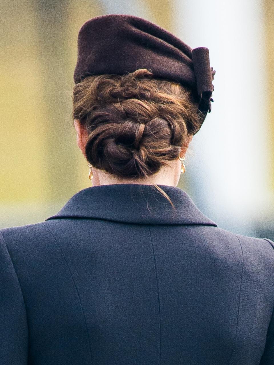 Catherine, Duchess of Cambridge, hair detail, as she attends the St Patrick's Day Parade at Mons Barracks on March 17, 2015 in Aldershot, England