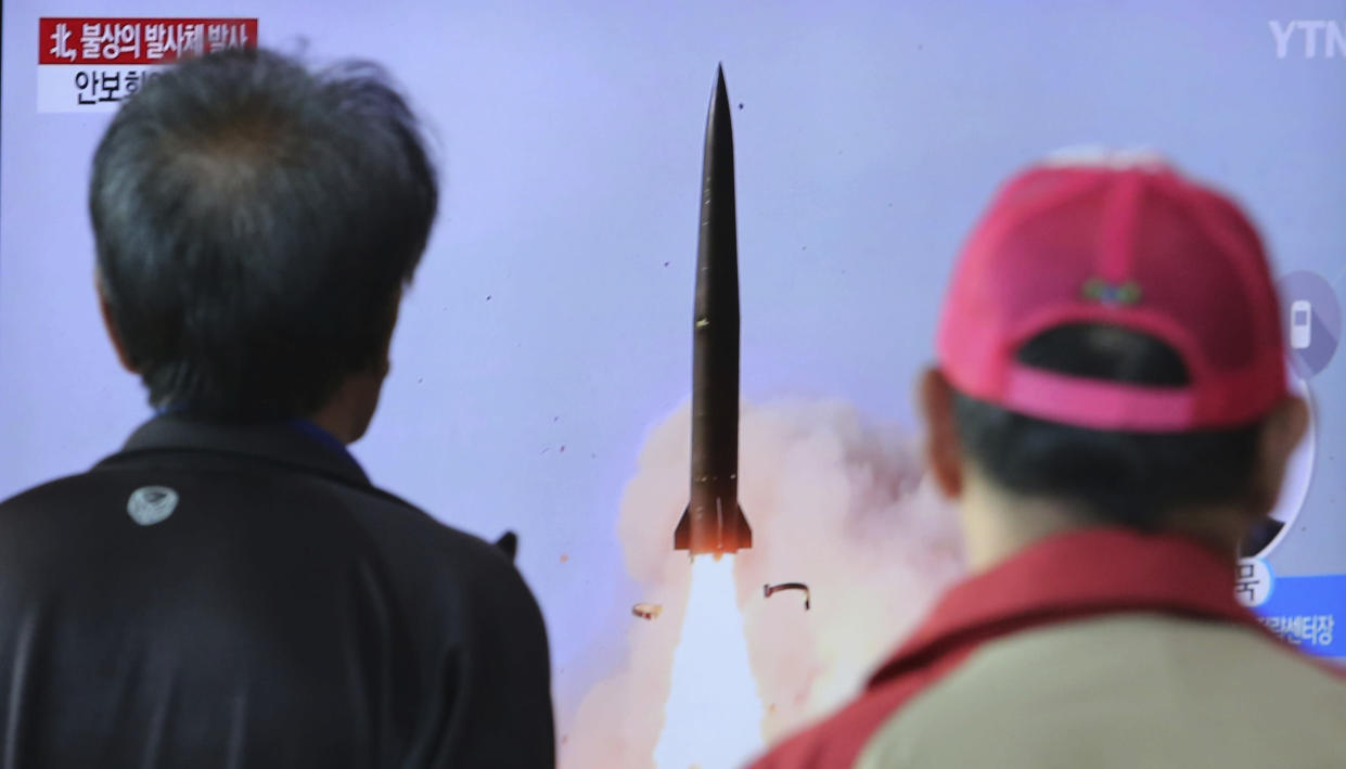 People watch a TV showing a file photo of North Korea's weapon systems during a news programme in Seoul, South Korea on Thursday. (AP Photo/Ahn Young-joon)