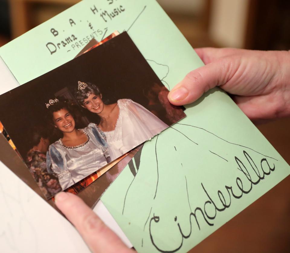 Dawn Sullivan holds a photo of her and Kristin Chenoweth from a high school play after getting a book signed by Chenoweth on Monday at Full Circle Bookstore in Oklahoma City.