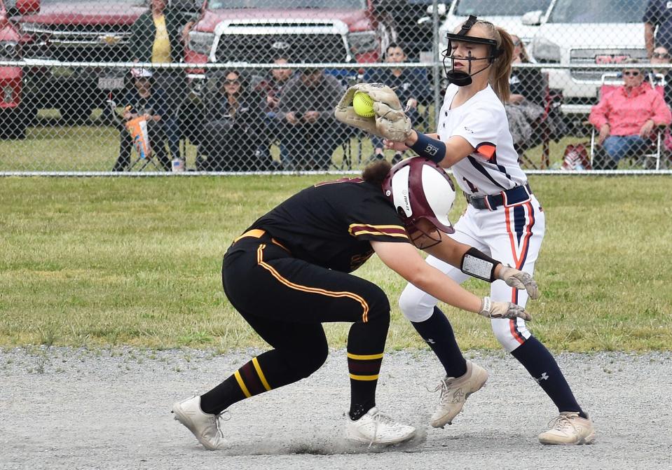 Case's Breanna Fontes gets back safely to second base during a rundown. Eagles shortstop Brooke Laudate gets there late.