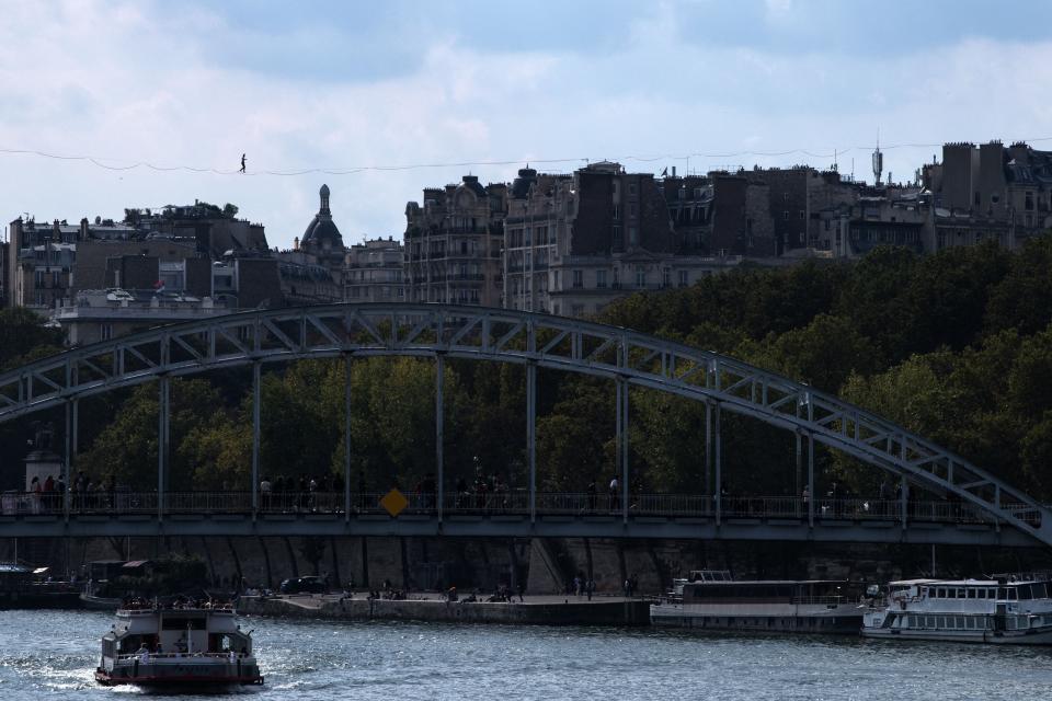 French highliner Nathan Paulin performed from the Eiffel Tower and the Theatre National de Chaillot.