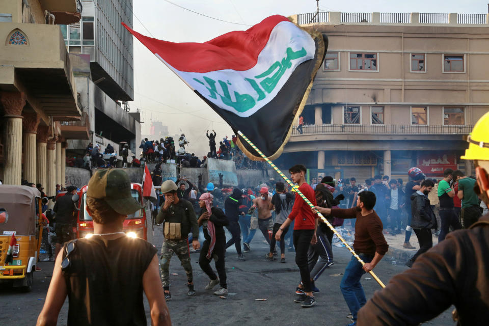 Anti-government protesters gather on Rasheed Street during clashes with security forces in Baghdad, Iraq, Thursday, Nov. 28, 2019. Scores of protesters have been shot dead in the last 24 hours, amid spiraling violence in Baghdad and southern Iraq, officials said. (AP Photo/Khalid Mohammed)