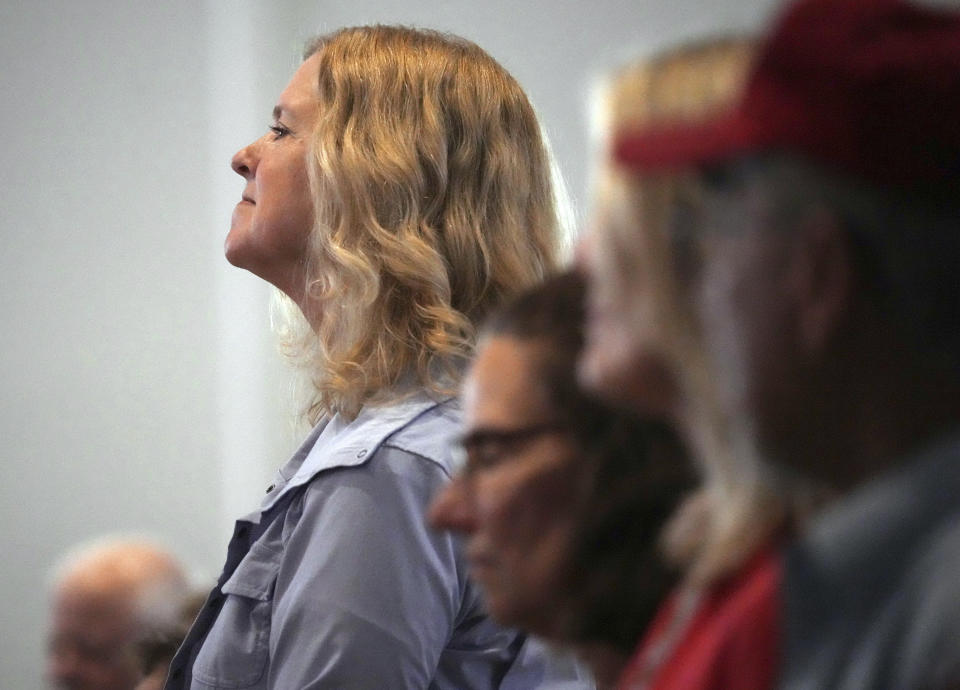 People attend a conference on conspiracy theories about voting machines and discredited claims about the 2020 presidential election at a hotel in West Palm Beach, Fla., Saturday, Sept. 10, 2022. The event featured Republicans running for statewide offices that oversee elections in some of the most important battleground states. (AP Photo/Jim Rassol)