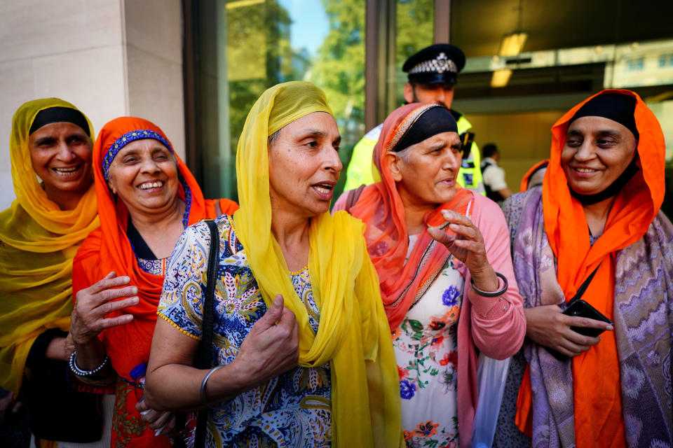 <p>People form the Sikh community show their support outside Westminster Magistrates Court in central London for three Sikh men facing extradition to India accused of murder who have been told there is insufficient evidence to bring the case against them. Picture date: Wednesday September 22, 2021.</p>
