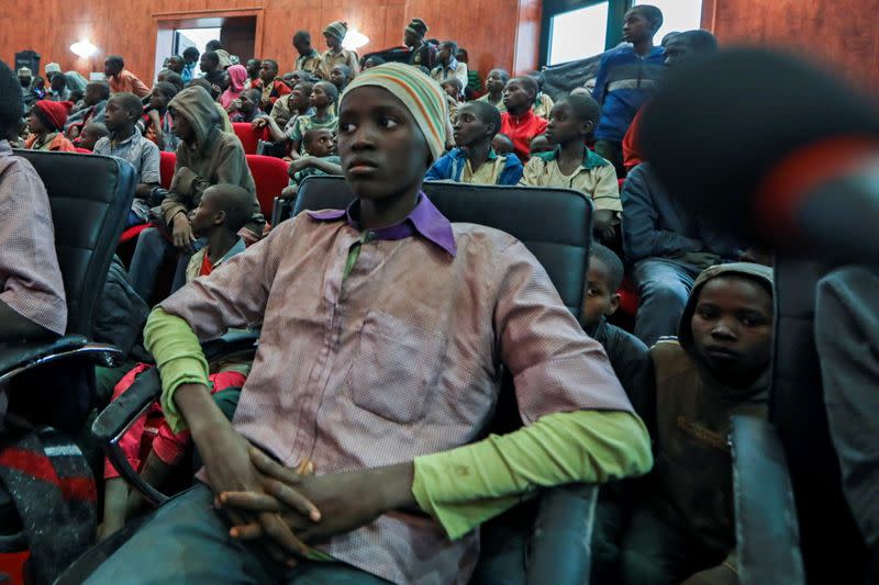 Rescued Nigerian school boys sit together at the Government house in Katsina