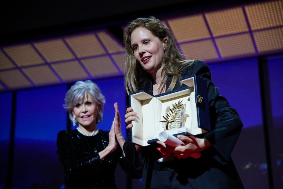 Justine Triet accepts the Palme d’Or from Jane Fonda (AP)
