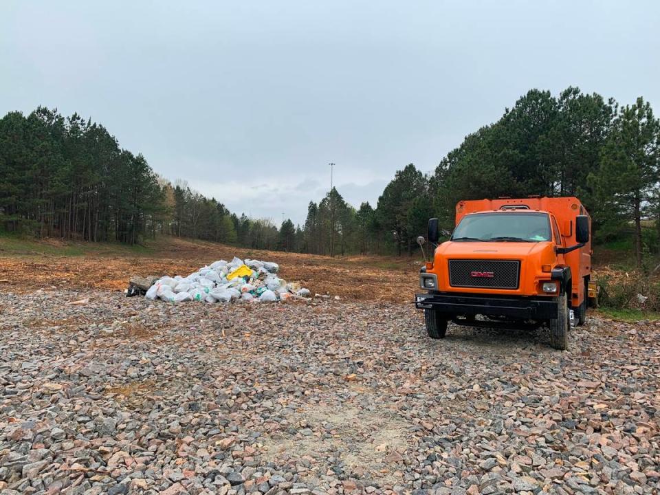 The N.C. Department of Transportation has cleared the site of a large homeless camp off Capital Boulevard at Interstate 540. Contractors expect to haul away 600 cubic yards of trash and debris and have cut down trees and brush that partially obscured the camp.