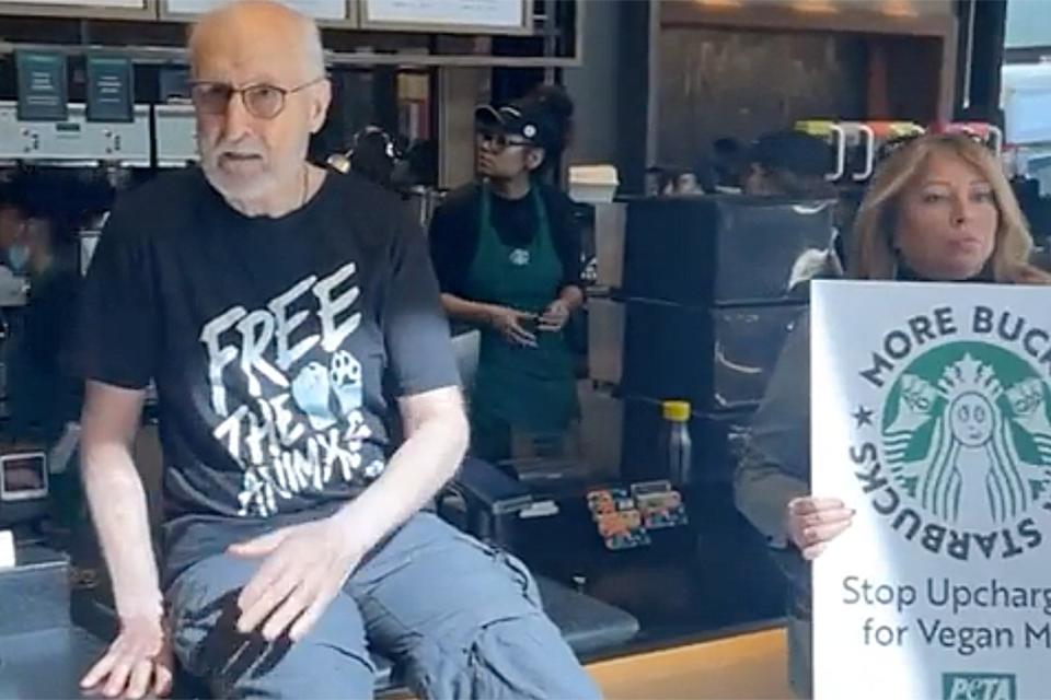 https://www.facebook.com/official.peta/videos/314196994124454 working hed: James Cromwell Glues Himself to Starbucks Counter in PETA's Protest Over Vegan Milk Prices