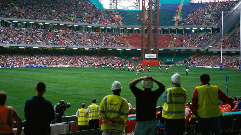 Construction workers watch Wales play South Africa at the Millennium Stadium