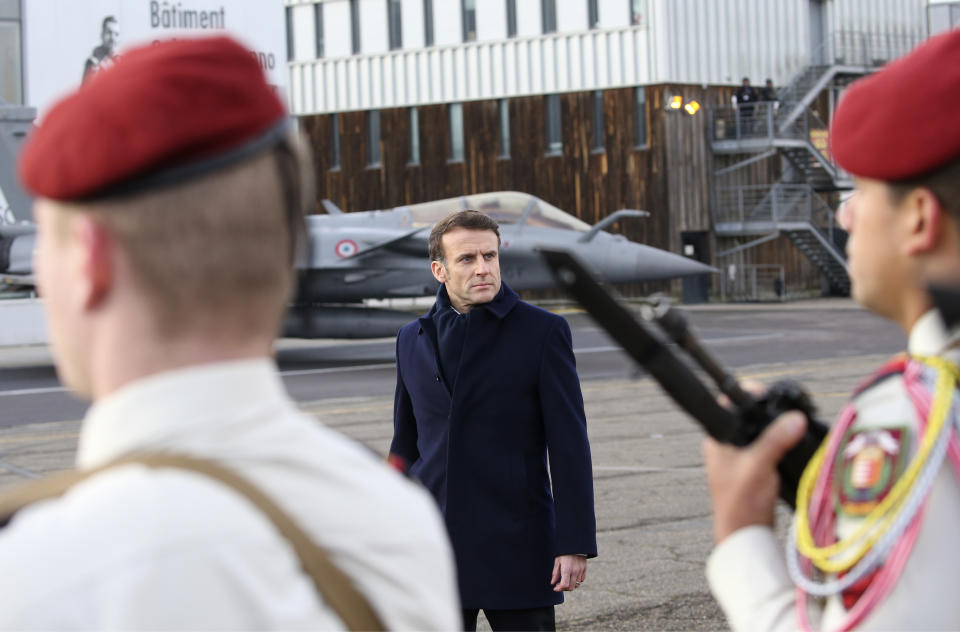 French President Emmanuel Macron reviews the troops before his New Year address to the French Army, Friday, Jan. 20, 2023 at the Mont-de-Marsan air base, southwestern France. President Emmanuel Macron is expected to unveil his vision for modernizing the military in his nuclear-armed country, taking into account the impact of the war in Ukraine and evolving threats around the world. (AP Photo/Bob Edme, Pool)