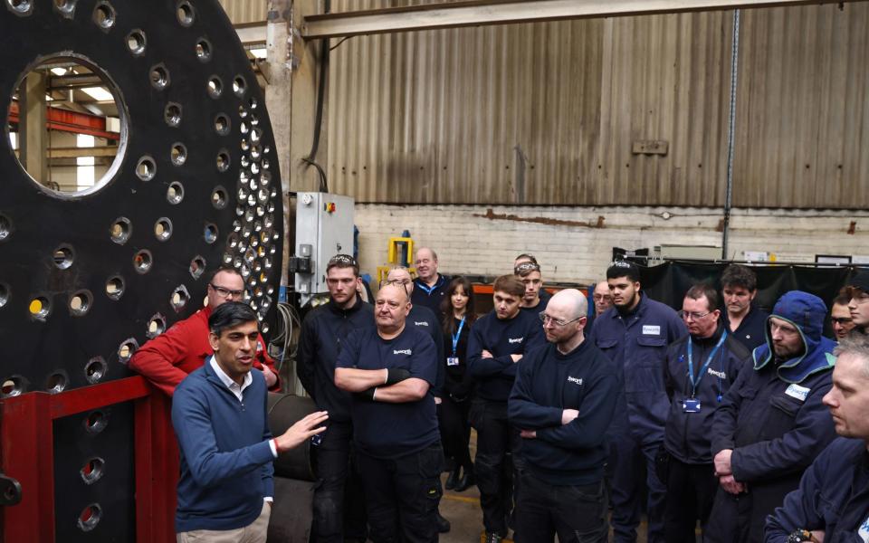 Rishi Sunak talks to staff during a visit to Byworth Boilers at the Parkwood Boiler works in Keighley, West Yorkshire