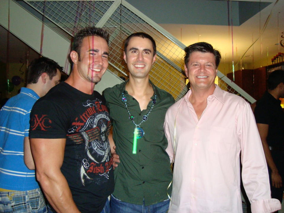 John Grove, left, with his brother Brian, center, and father Bob, right, at a party in 2008. (Photo: Courtesy of Bob Grove)