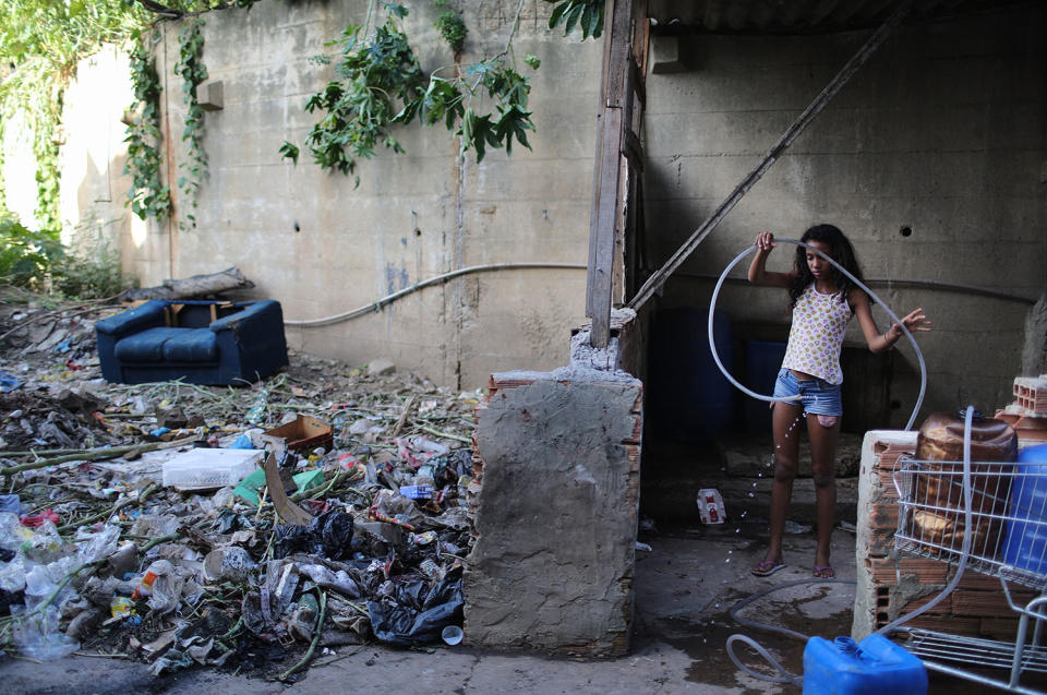 Girl handling water hose