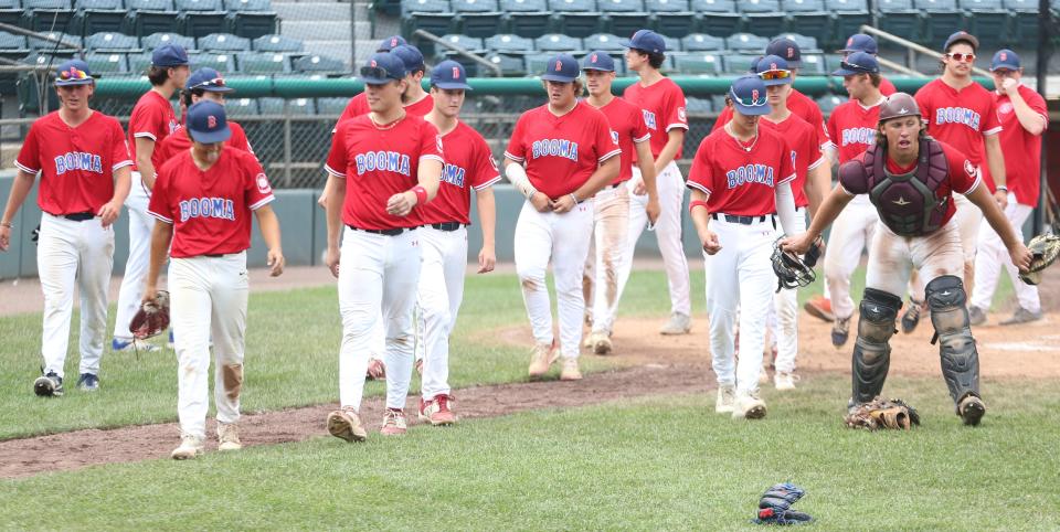 Members of the Booma Post 6 baseball team walk off the field following Friday's 6-1 win over Laconia Post 1 in the opening round of the American Legion state tournament at Holman Stadium in Nashua.