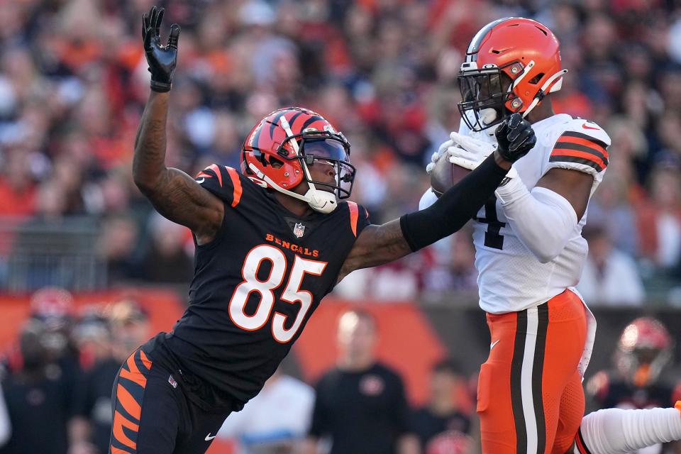 Cleveland Browns middle linebacker Anthony Walker (4) intercepts a pass tipped off the hands of Cincinnati Bengals wide receiver Tee Higgins (85), which was later called back after a penalty, in the second quarter during a Week 9 NFL football game, Sunday, Nov. 7, 2021, at Paul Brown Stadium in Cincinnati. The Cleveland Browns lead the Cincinnati Bengals 24-10 at halftime.