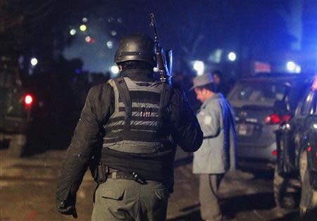 An Afghan police officer arrives at the scene of an explosion in Kabul January 17, 2014. REUTERS/Omar Sobhani