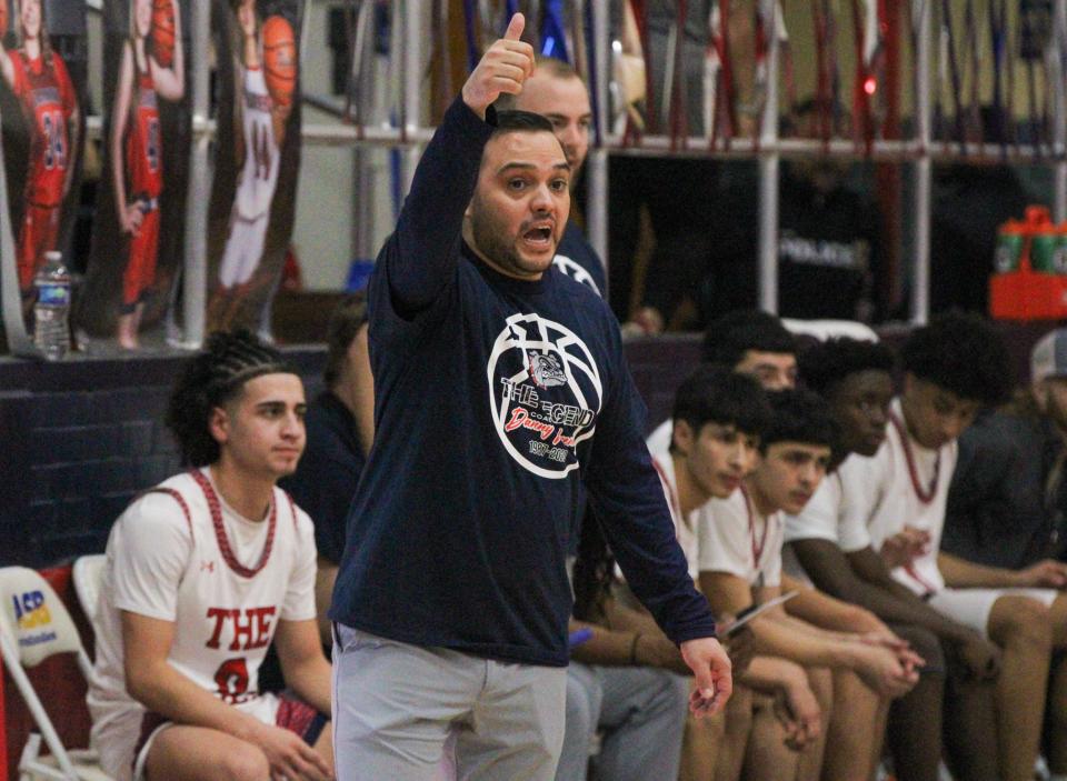 Plainview head coach Marc Puente gestures to his team during a District 3-5A boys basketball game in the Dog House at Plainview on Friday, Feb. 3, 2023.