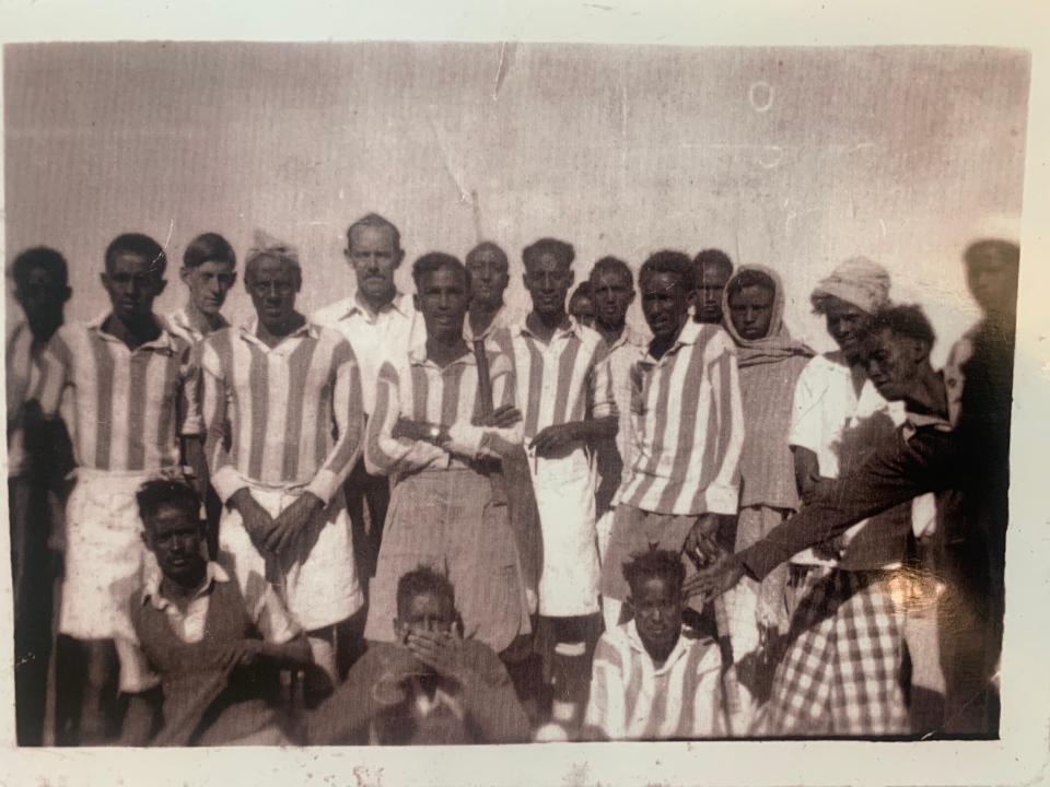 Ali Mire Awaale (back row, sixth from left) played field hockey with a team in Somalia.