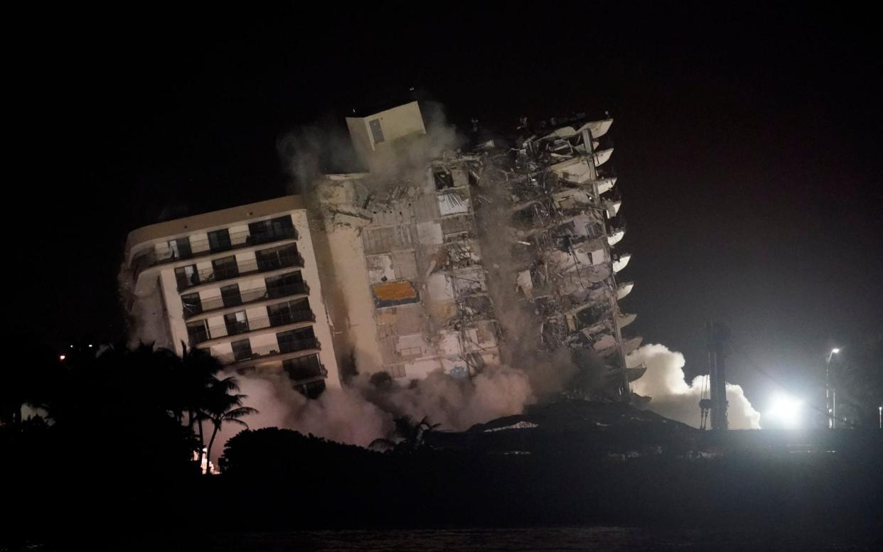 The damaged remaining structure at the Champlain Towers South condo building collapses in a controlled demolition - AP Photo/Lynne Sladky