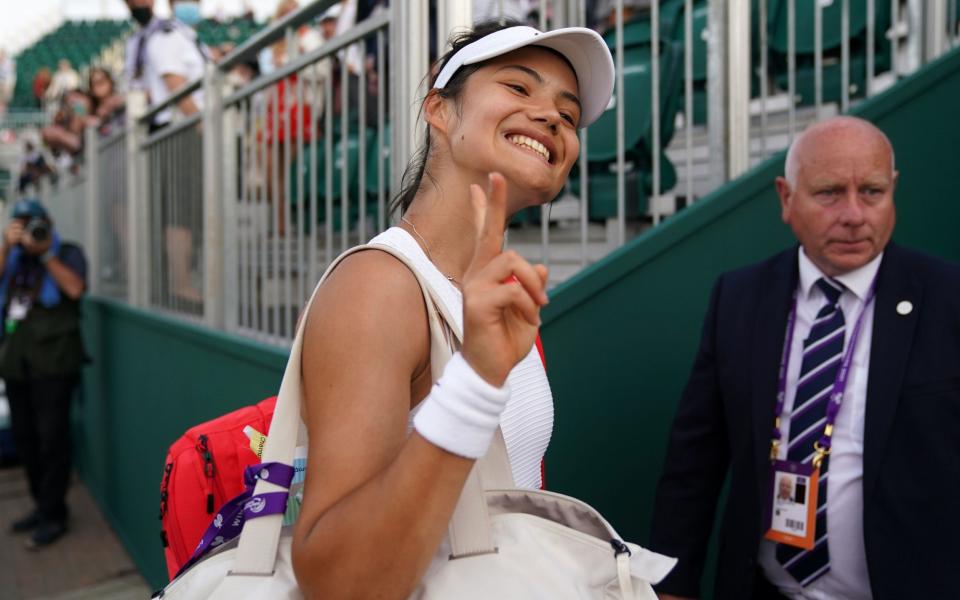 Emma Raducanu leaves the court after her victory - PA