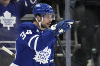 Toronto Maple Leafs center Auston Matthews (34) celebrates his goal against the Florida Panthers during the first period of an NHL hockey game in Toronto on Monday, April 1, 2024. (Frank Gunn/The Canadian Press via AP)
