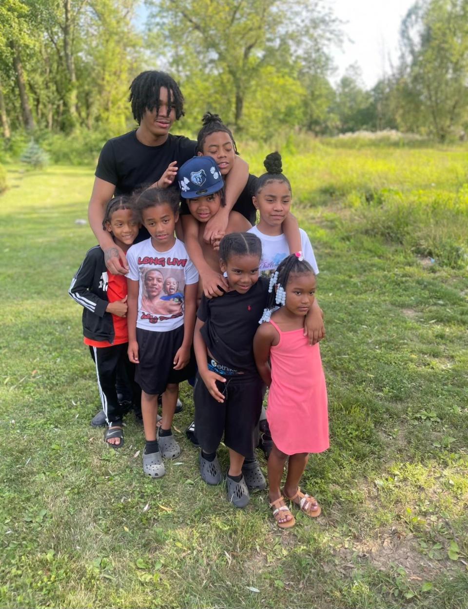 Ra'Shawyn Carter Jr., 15, pictured here in July, died after being shot on Aug. 27, 2023 at Easton Town Center. He was very close with his younger siblings and step-siblings, who he is pictured with here.