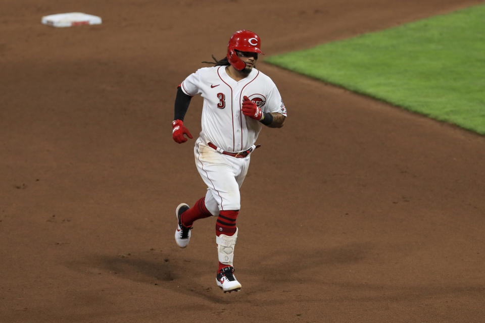 Cincinnati Reds' Freddy Galvis hits a two-run home run in the seventh inning during a baseball game against the Kansas City Royals in Cincinnati, Wednesday, Aug. 12, 2020. (AP Photo/Aaron Doster)