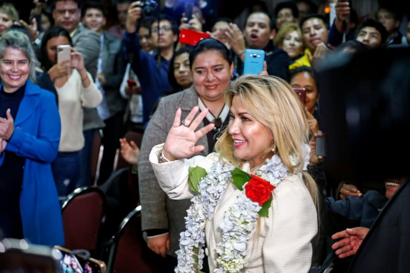 Bolivia’s interim President Jeanine Anez waves before a ceremony to announce her nomination as presidential candidate for the upcoming elections on May 3, in La Paz, Bolivia