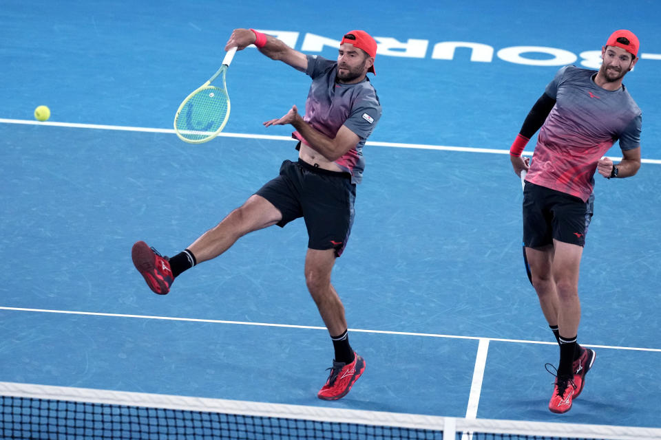 Simone Bolelli and Andrea Vavassori of Italy in action against Rohan Bopanna of India and Matthew Ebden of Australia during the men's doubles final at the Australian Open tennis championships at Melbourne Park, Melbourne, Australia, Saturday, Jan. 27, 2024. (AP Photo/Alessandra Tarantino)