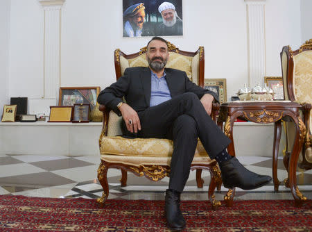 Atta Mohammad Noor, Governor of the Balkh province, poses for a photo before an interview in Mazar-i-Sharif, Afghanistan January 1, 2018. REUTERS/Anil Usyan