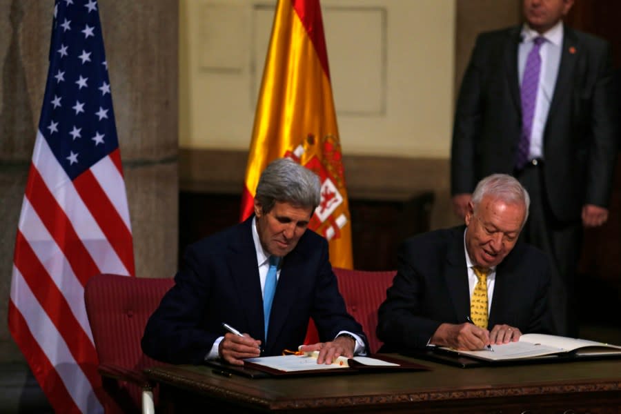 U.S. Secretary of State John Kerry, left, and Spain’s Foreign Minister Jose Manuel Garcia Margallo sign agreements at the Santa Cruz palace, Spain’s Foreign Affairs Ministry, in Madrid, Spain, Monday, Oct. 19, 2015. Spain and the United States signed an agreement Monday to further discuss the cleanup and removal of land contaminated with radioactivity after a mid-air collision in 1966 dumped four U.S. hydrogen bombs near the southern Spanish village of Palomares. (AP Photo/Francisco Seco)