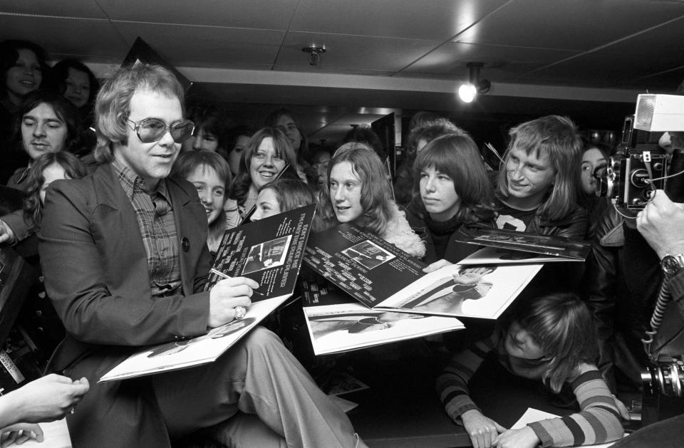 Elton John signs copies of his new album, 'Don't Shoot Me I'm Only The Piano Player' at the Noel Edmonds's Record Shop, Chelsea.