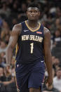 New Orleans Pelicans' Zion Williamson walks upcourt during the second half of an NBA preseason basketball game against the San Antonio Spurs, Sunday, Oct. 13, 2019, in San Antonio. (AP Photo/Darren Abate)
