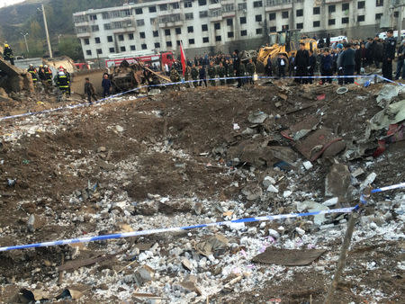 Rescue workers are seen at site after an explosion hit a town in Fugu county, Shaanxi province, China, October 24, 2016. China Daily/via REUTERS