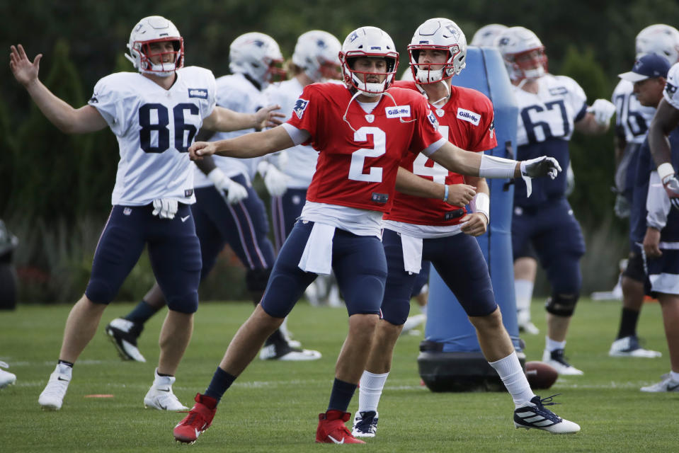 New England Patriots quarterbacks Brian Hoyer (2) and Jarrett Stidham (4) warm up along with and tight end Andrew Beck (86) at NFL football practice, Monday, Aug. 19, 2019, in Foxborough, Mass. (AP Photo/Elise Amendola)