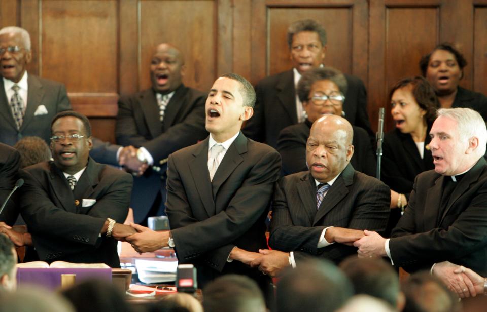 From left: Brown Chapel AME Church pastor James Jackson,  Democratic presidential candidate Sen. Barack Obama, D-Ill., Rep. John Lewis, D-Georgia, and Rev. Clete Kiley, hold hands and sing at the end of a church service, Sunday March 4, 2007 in Selma, Ala.