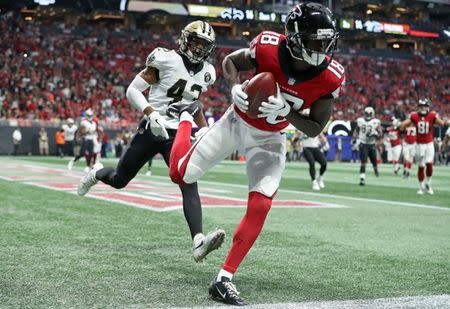 Sep 23, 2018; Atlanta, GA, USA; Atlanta Falcons wide receiver Calvin Ridley (18) catches a touchdown pass against the New Orleans Saints defensive back Marcus Williams (43) in the third quarter at Mercedes-Benz Stadium. Mandatory Credit: Jason Getz-USA TODAY Sports