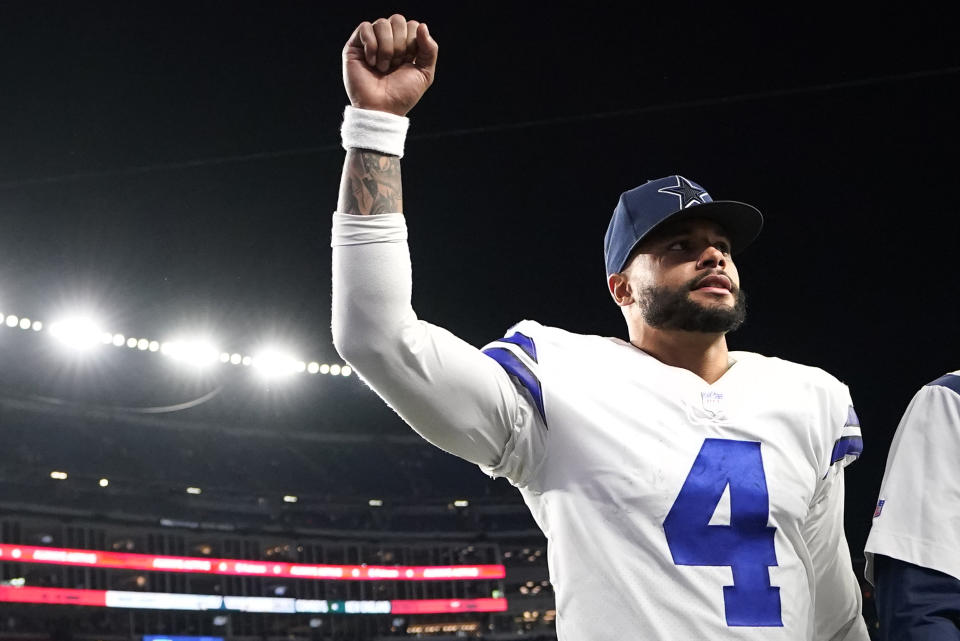 Dallas Cowboys quarterback Dak Prescott (4) pumps his fist towards fans after an overtime win against the New England Patriots following an NFL football game, Sunday, Oct. 17, 2021, in Foxborough, Mass. (AP Photo/Steven Senne)